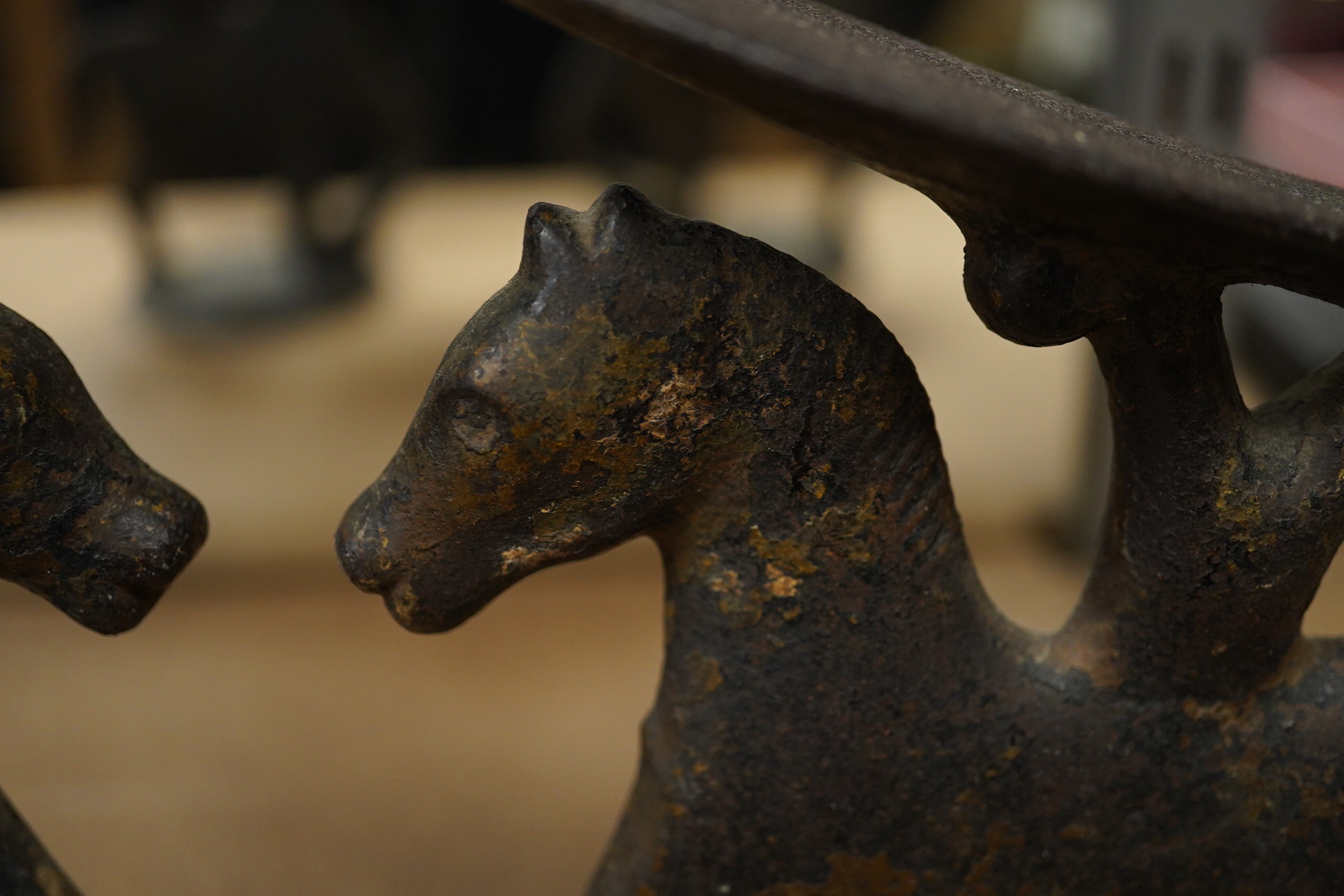 A small pair of novelty iron ‘horse’ boot scrapers. 18cm high. Condition - poor, base mounts missing